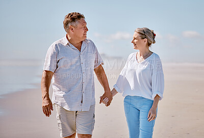 Buy stock photo Beach, love and senior couple holding hands while walking for health, exercise and wellness. Happy, romance and elderly man and woman on romantic walk together in nature by ocean or sea in Australia.