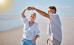 Happy senior couple, dancing and beach for summer vacation, romance or bonding together in the outdoors. Elderly man and woman with smile for romantic dance, anniversary or holiday joy by the ocean