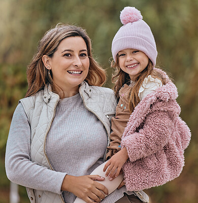 Buy stock photo Family, children and portrait with a mother and daughter bonding outdoor during the winter season with love. Kids, garden and smile with a woman and happy girl child standing together outside