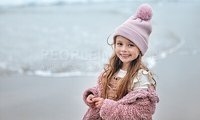 Buy stock photo Happy girl child on beach, portrait on winter holiday with pink beanie and kid smile on the Dublin seaside. Outdoor freedom on ocean break, cute toddler relaxing by the water and coastal peace