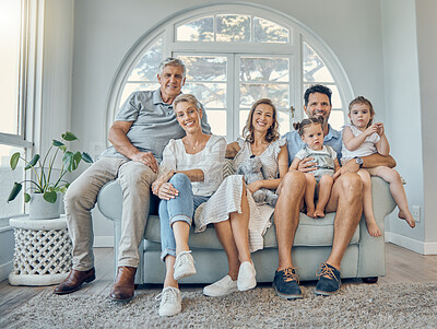 Buy stock photo Big family, portrait and generations relax together on couch in living room at home. Happy grandparents, mother smile and father love adorable young children, calm and sitting on lounge sofa bonding