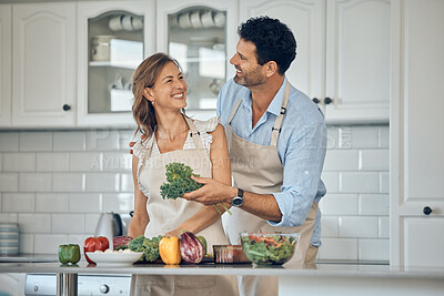 Buy stock photo Couple, cooking and vegetable in kitchen together, healthy food and nutrition, happy with chef skill at home. Man, woman and cook with smile, fresh organic vegetables and preparing salad for meal.