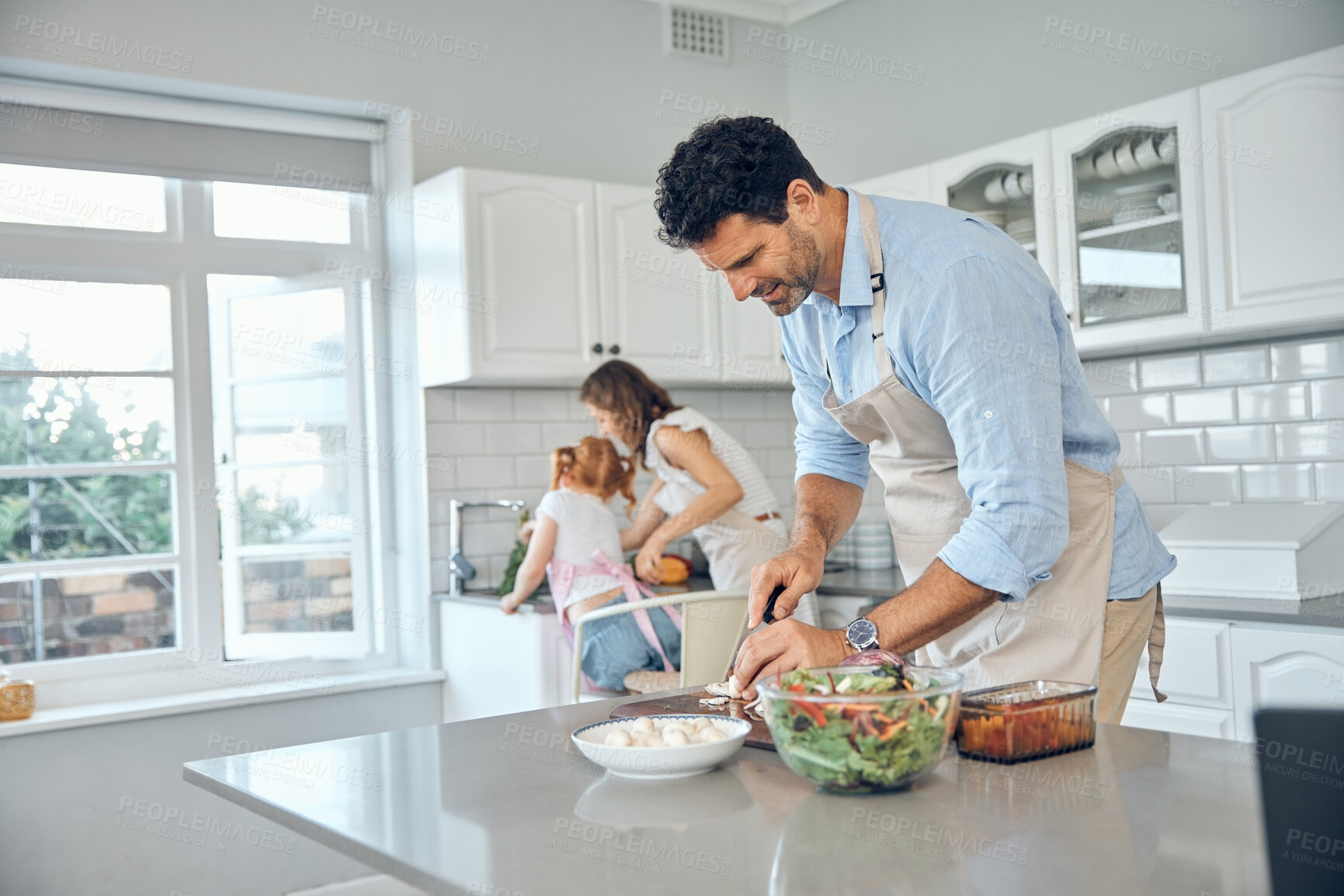 Buy stock photo Mom, dad and child cooking in kitchen together to prepare food for lunch supper and dinner. Family, helping hands and father cutting, slice and chop with mother and girl helping clean vegetables