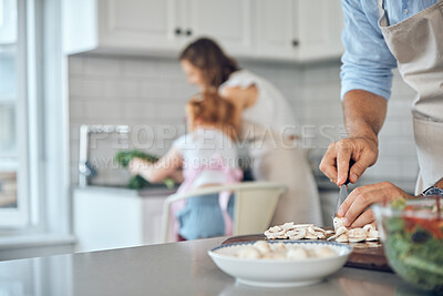 Buy stock photo Food, hands and man cooking for family in kitchen with healthy, raw and vegetables in their home. Parents, multitasking and bond with girl while cleaning, talking and prepare a health meal or salad