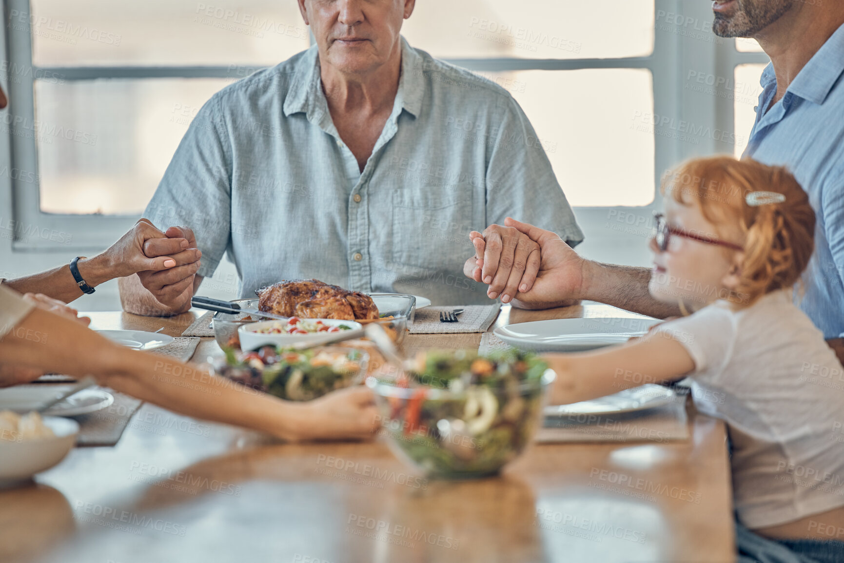 Buy stock photo Prayer, food and family holding hands at lunch, brunch or buffet meal for bonding quality time. Christian religion, grace and spiritual people praying for holy support, hope and worship god and Jesus