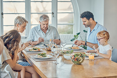 Buy stock photo Family, food and children with grandparents, parents and grandkids around a dining room table together for lunch. Love, dinner and eating with a senior man and woman enjoying a meal with relatives