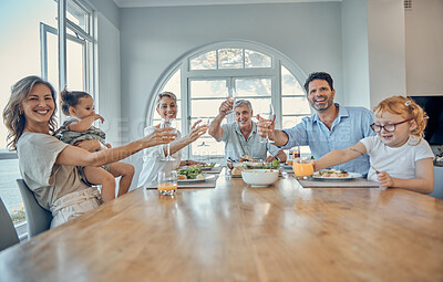 Buy stock photo Family, dinner food and cheers of a mother, senior people and children happy at home. Portrait of a happy toast, mother and father with children care at a table eating at a house with happiness