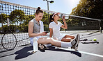 Woman, friends and tennis in sport break, relaxing or time out together on the court in the outdoors. Fitness women in relax after sports game, match or healthy cardio workout at the tennis court