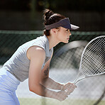 Fitness, tennis and athlete with a racket on a court ready for a game, practice or training. Sports, exercise and healthy young woman from Canada preparing for a hit at a match on an outdoor field.
