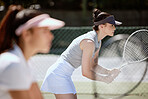 Focus, tennis and team of women in court for competition, game or training outdoor with challenge, teamwork and goal strategy. Fitness, sports and club for athlete people with tennis court motivation