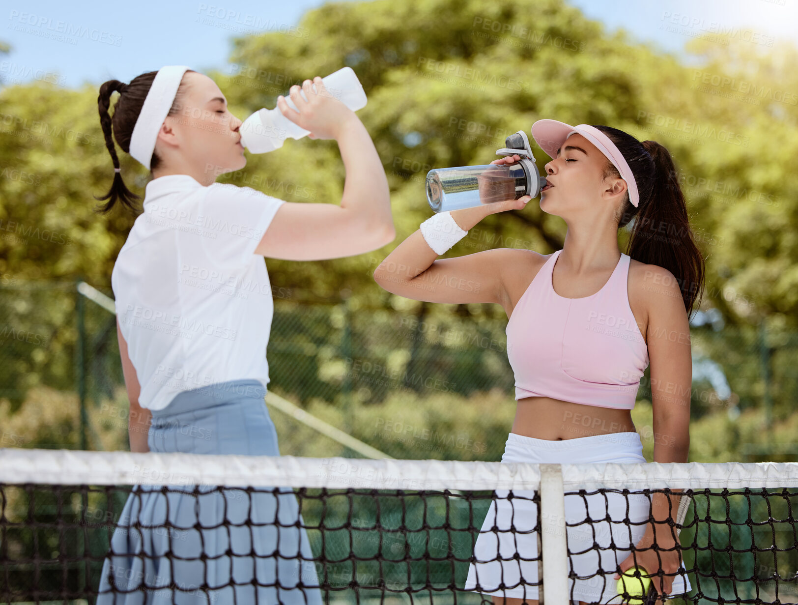 Buy stock photo Water, tennis women hydrate and fitness workout with training coach relax on tennis court. Team health, success sports exercise and goal motivation or collaboration outdoors with bottle for hydration