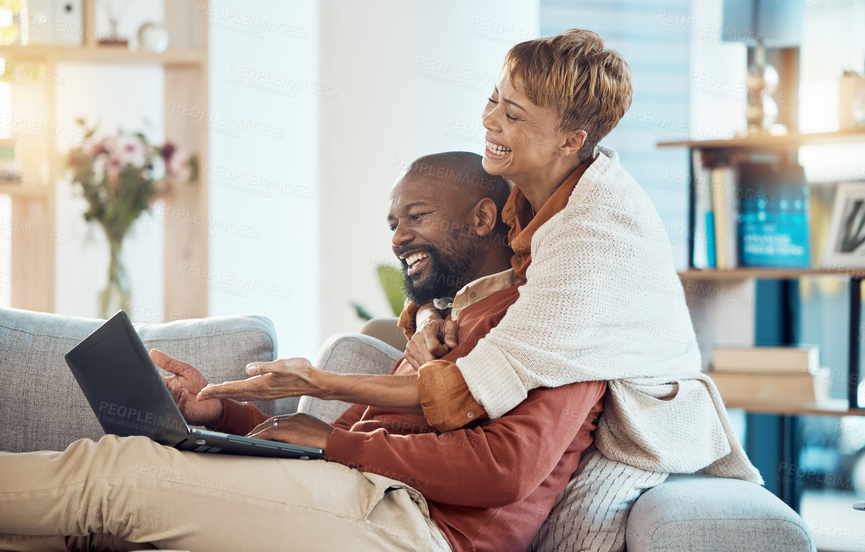 Buy stock photo Laptop, sofa and couple laughing at video online, relax watching funny movie streaming service. Internet, technology and video call, mature woman and black man on living room couch with happy smile.