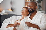 Spa couple, champagne and relax in wellness salon for love, hospitality and calm therapy at luxury hotel, vacation or peace together. African man, black woman and drinking wine after skincare massage
