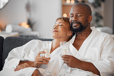 Buy stock photo Spa couple, champagne and relax in wellness salon for love, hospitality and calm therapy at luxury hotel, vacation or peace together. African man, black woman and drinking wine after skincare massage