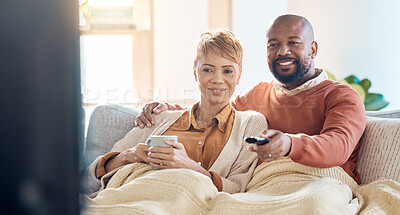 Buy stock photo Mature couple, bonding or watching tv on sofa in house or home living room on streaming channel or multimedia subscription. Happy smile, black woman and man with television movie show or relax coffee