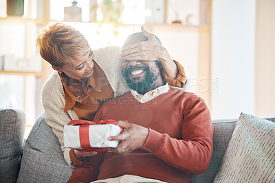 Buy stock photo Love. black couple and surprise with present, celebrate birthday and being happy, loving and together in living room. Romantic, senior woman and mature man have fun, with gift for anniversary and joy