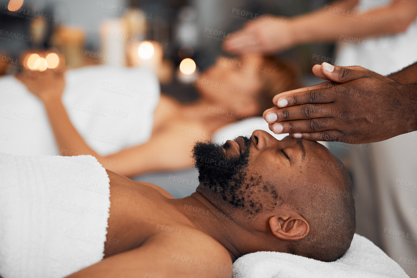 Buy stock photo Black man, head massage and being calm, relax and clear mind being stress free, release tension and calm laying on table. African American male, spa treatment and body care for wellness or health