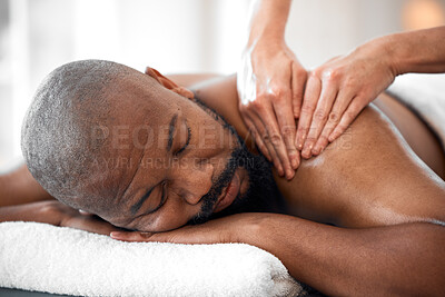 Buy stock photo Relax man, spa and back massage for luxury wellness, therapy, healing and skincare. Therapist touch body, muscle and reflexology of sleeping black man on salon bed, stress relief and holistic detox 