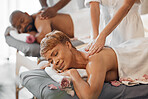 Relax, spa and senior couple get massage together at hotel, for romantic anniversary weekend. Health, wellness and romance, luxury back massage for mature black woman and man, relaxing in retirement.