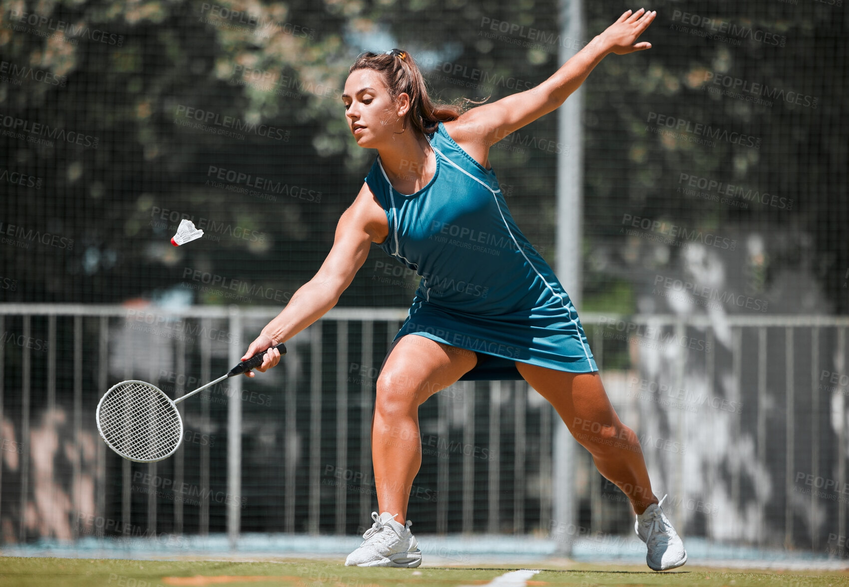 Buy stock photo Sports, badminton and woman play game, fitness competition and practice match for outdoor tournament. Exercise, wellness and healthy athlete hit shuttlecock in performance workout on training court