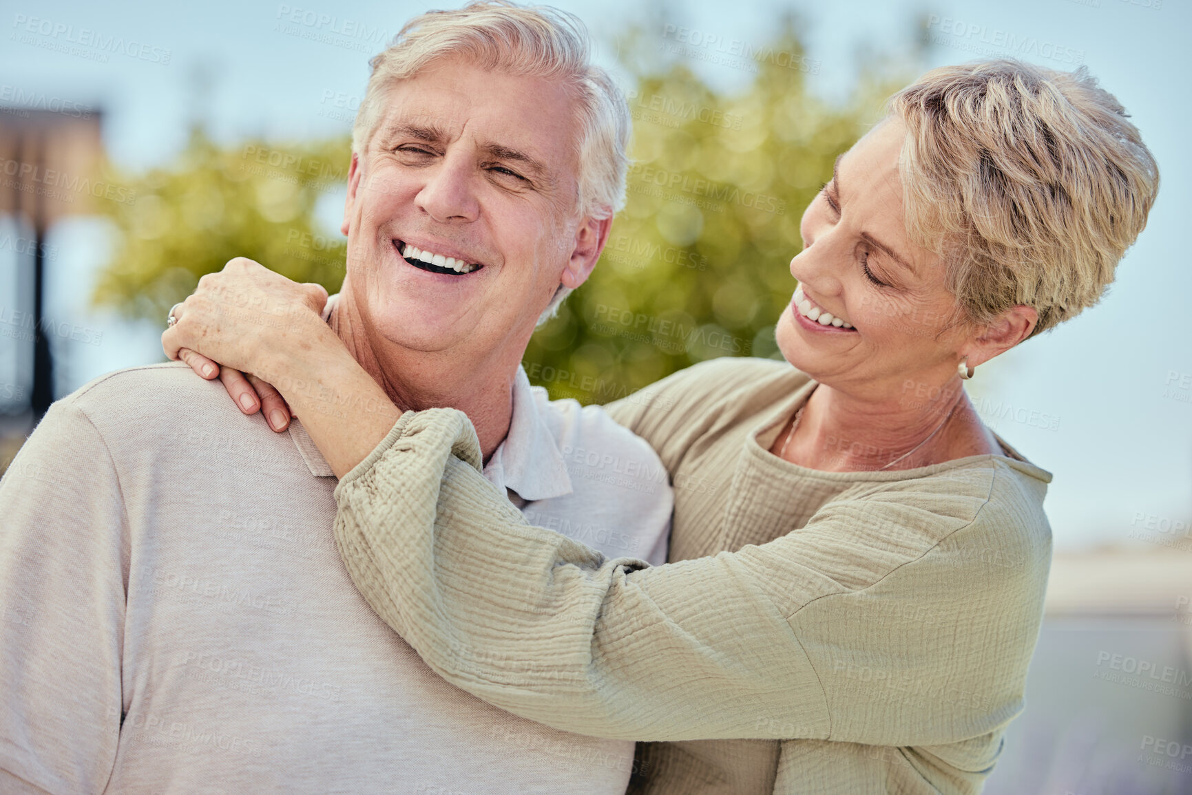 Buy stock photo Happy, senior couple and smile for love, hug and joy for relationship, bonding and romance in happiness for the outdoor. Elderly man and woman relax, smiling and care together in marriage for travel