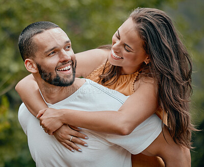 Buy stock photo Piggy back, couple and happy hug of a man and woman in nature with love, care and happiness. People with a smile and play together smiling about romantic anniversary and loving relationship outdoor