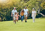 Grandparents, parents and children being happy, bonding and loving outdoor together for quality time. Family, love and walking in summer being happy, smile and laugh to have fun with kids and relax.