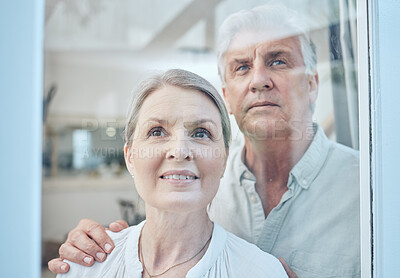 Buy stock photo Family, couple and senior people at a window for looking, talking and embrace, happy and smile in their home. Glass, happy family and proud seniors bond, relax and discuss the view from their house