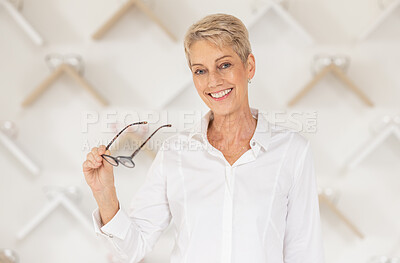 Buy stock photo Glasses, vision and eyesight with a woman customer buying prescription lenses at the optometrist. Portrait, eyewear and retail with a mature female consumer spending money on spectacles in a store