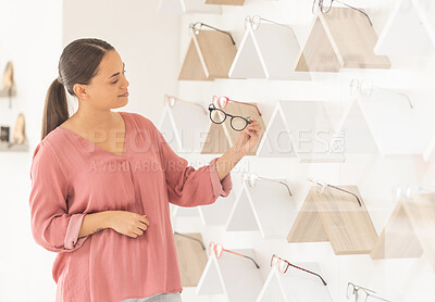 Buy stock photo Optometry, vision and woman choosing glasses in retail optical store for eye health, wellness and care. Optician, spectacles and lady customer picking a frame for prescription lenses in eyewear shop.