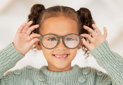 Buy stock photo Vision, eye care and portrait of child with glasses for optical healthcare, eyesight support and test prescription eyeglasses. Optometry store, retail choice and happy youth girl trying on lens frame