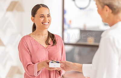 Buy stock photo Happy customer, pharmacy or optician retail store for glasses, healthcare and eye care while buying glasses, medicine or product. Woman with smile while shopping and happy about service in a shop