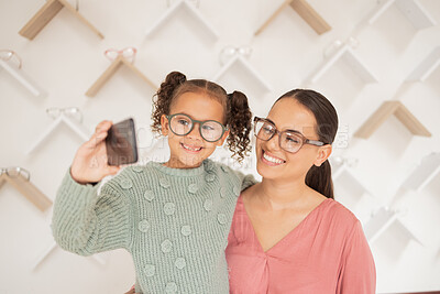 Buy stock photo Phone, mother and child take a selfie at optometrist in new glasses after shopping for a family discount. Smile, mom and happy girl buying new frames for better eyesight or vision at a retail store