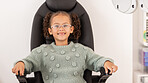 Girl child, eye test glasses and smile in portrait at optometrist  office, clinic or hospital for visual impairment. Young, female kid sitting or examination of eyes, sight and vision at optical exam