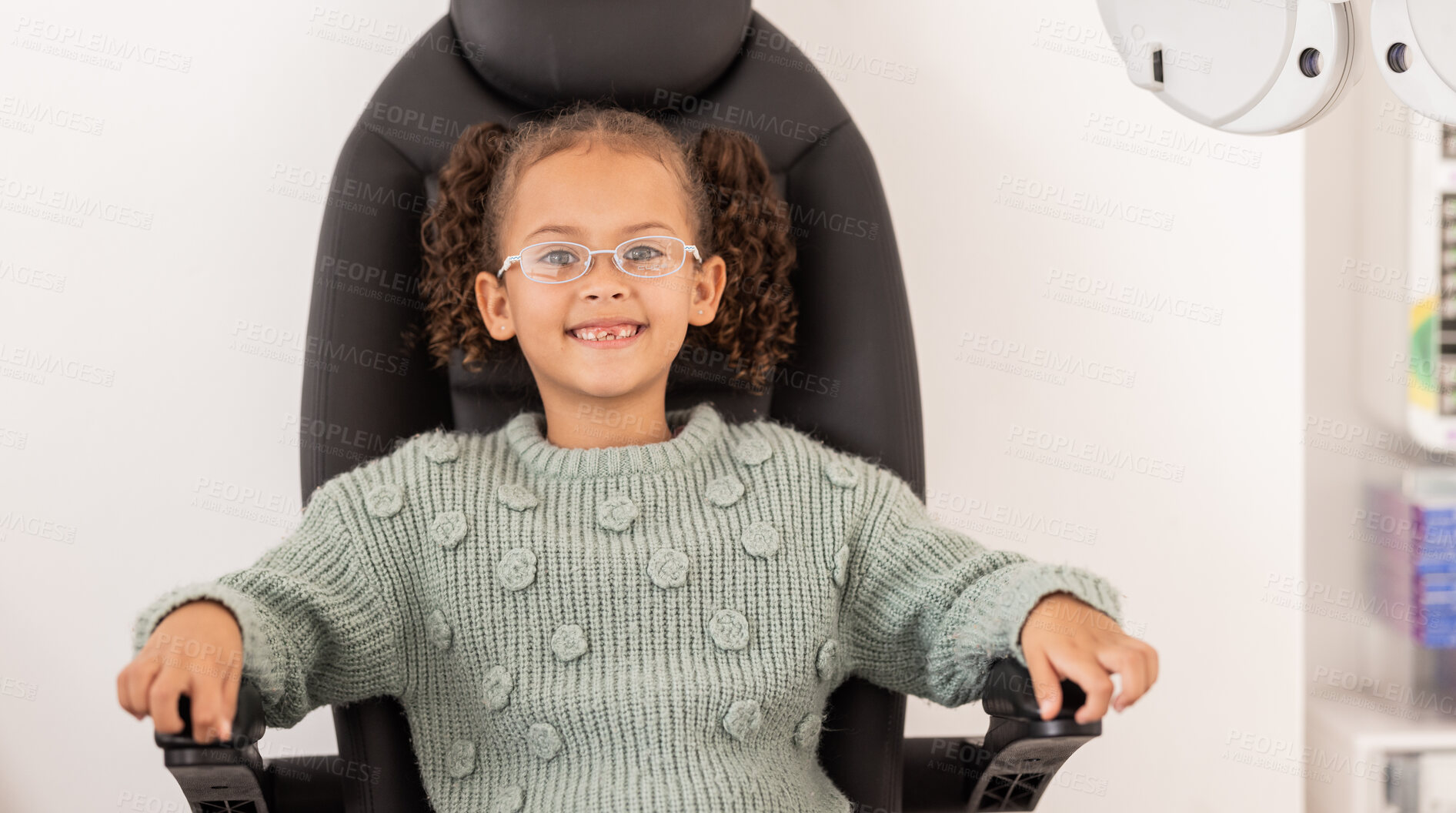 Buy stock photo Girl child, eye test glasses and smile in portrait at optometrist  office, clinic or hospital for visual impairment. Young, female kid sitting or examination of eyes, sight and vision at optical exam