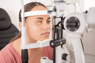 Buy stock photo Vision, ophthalmology and woman in eye exam with light on iris at eye doctors office. Healthcare, medical insurance and eyes, girl getting healthy visual refraction eye test at ophthalmologist clinic