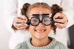 Eye, vision and test with child for glasses in optometry office for eye care and health. Eyewear, exam and medical opthalmology with little girl testing for lenses and frames diagnosis for optics