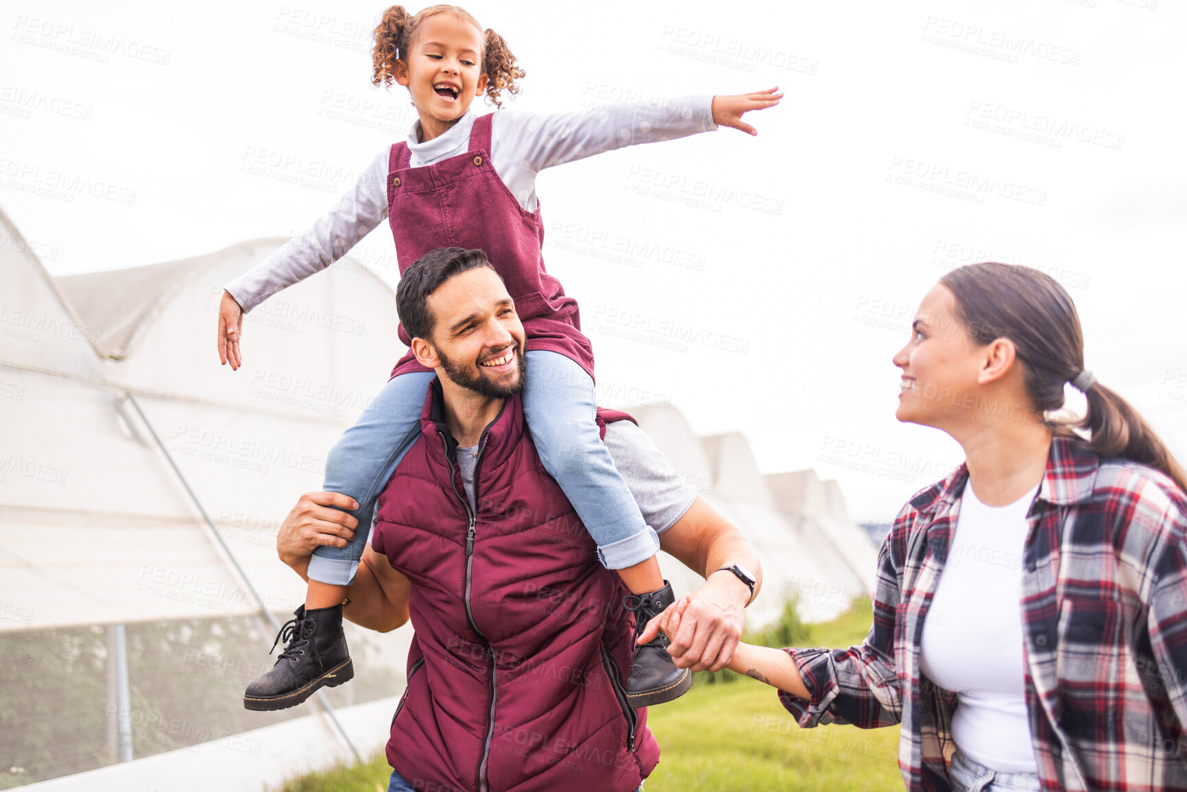Buy stock photo Child, mother and father holding hands on a farm as a lovely and supportive happy family farming in Colombia. Smile, dad and woman with a young girl or kid enjoying quality time, walking and bonding