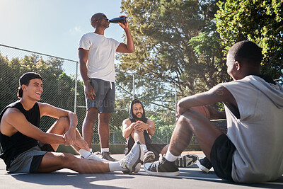 Buy stock photo Friends, sports and team relax after training on basketball court outdoors. Young athlete men, exercise workout rest and happy teamwork conversation or group discussion together in nature park
