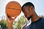 Basketball on forehead, motivation and black man on basketball court ready for competition, match or game. Basketball player, sports and male from Nigeria preparing for training, fitness or exercise.
