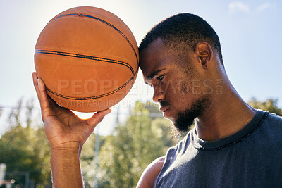 Buy stock photo Basketball on forehead, motivation and black man on basketball court ready for competition, match or game. Basketball player, sports and male from Nigeria preparing for training, fitness or exercise.