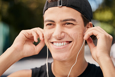 Buy stock photo Fitness, exercise and man listening to music with earphones in park, outdoors and nature. Workout, sport and happy male with smile on face ready for training with headphones for track, audio and song