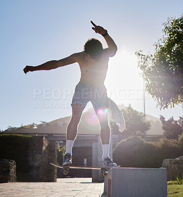 Buy stock photo Skateboard, ramp and young man doing a trick at an outdoor park for fun, fitness or training. Adventure, freedom and athlete or skater doing a extreme sports stunt in nature in a urban street.