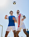 Sports, soccer and athletes doing a trick with ball on a field for a match, training or exercise. Fitness, football and men playing a game at a competition, tournament or championship on a pitch.