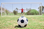 Soccer ball, football field and goalkeeper ready for defense to stop goals for penalty kick game on soccer field, grass pitch and sports stadium. Football player, goalie challenge and target training
