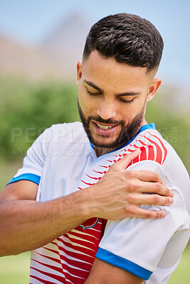 Buy stock photo Sports, football and man with shoulder pain, injury or training accident from competition, exercise or fitness workout. Game emergency, muscle problem and athlete soccer player hurt on soccer field