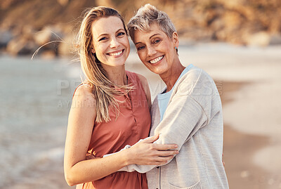 Buy stock photo Women, mom and daughter hug on beach enjoy nature and family time together on the shore with smile. Love, water and portrait of woman hugging senior mother on happy ocean holiday and walk on sea sand