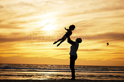 Buy stock photo Sunset, silhouette and father with child at the beach with love and care on summer vacation. Playful, freedom and man playing with his kid in nature by ocean or sea on holiday, adventure or journey.