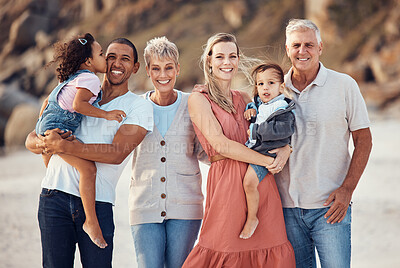 Buy stock photo Interracial family, beach smile and children together on a bonding with happiness and kid care. Portrait of a happy, vacation and parents with senior grandparents holding kids with love outdoor