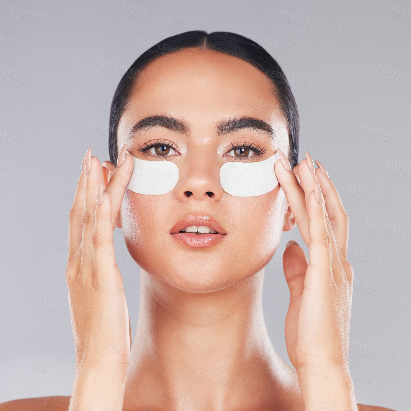 Buy stock photo Face, skincare and woman with eye patches on a gray studio background. Portrait, beauty and model from Canada with facial collagen pads or dermatology product for anti aging, hydration or wellness.